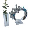 Blue and turquoise crown with silver leaf detail.